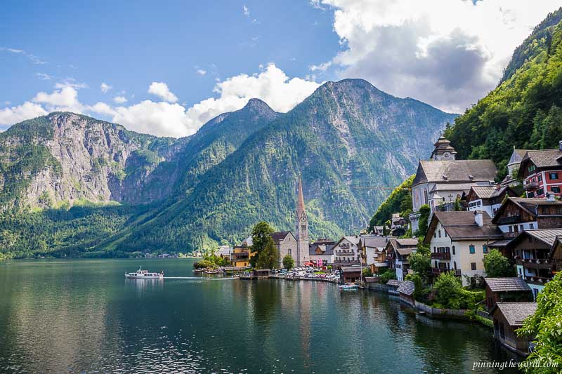 Hallstatt's old church at the banks of the lake and surrounded by the Dachstein mountains